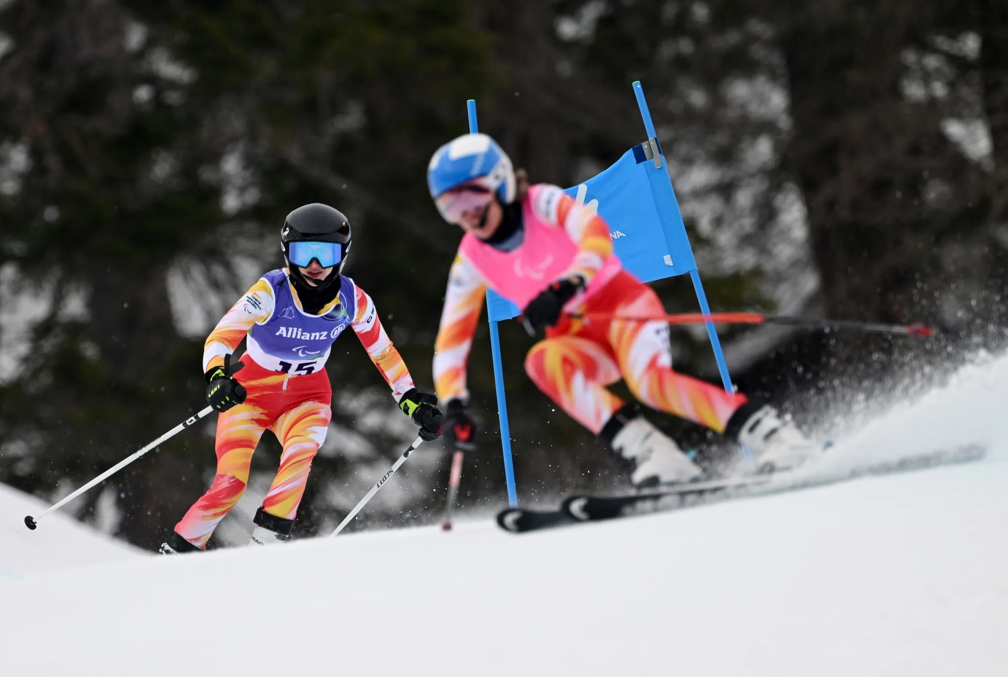 Alejandra Requesens, left, competes in the Para Alpine Skiing Women’s Giant Slalom Vision Impaired, alongside her guide Victoria Ibanez, at the Paralympic Games, on March 12.