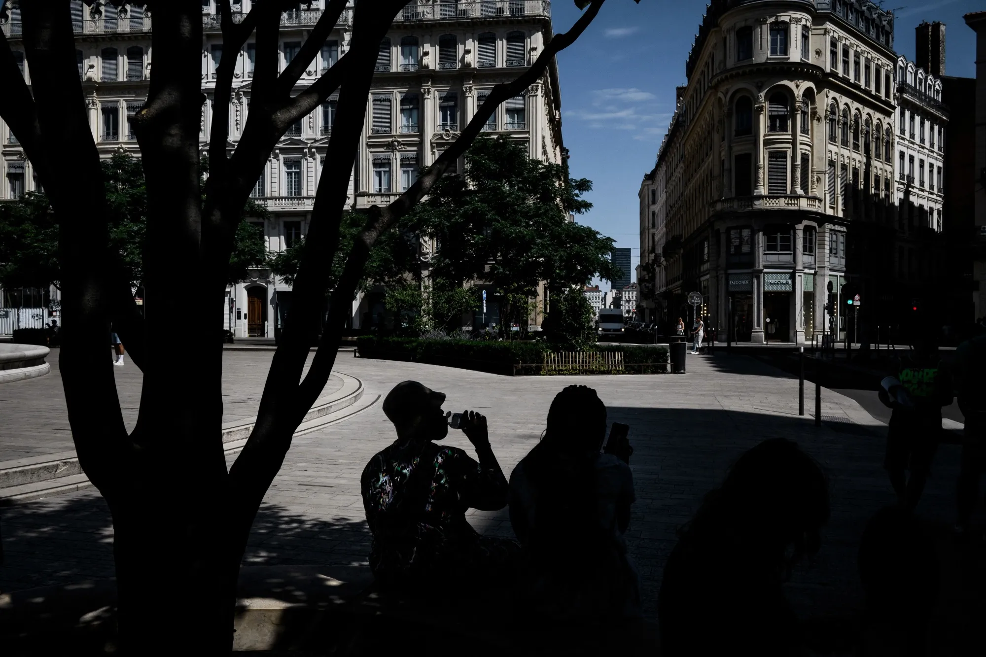 People sit in the shade during a heatwave in Lyon, France on August 15.