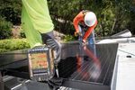 Petersen Dean Inc. employees install solar panels on the roof of a home in Lafayette, Calif., on May 15, 2018.&nbsp;