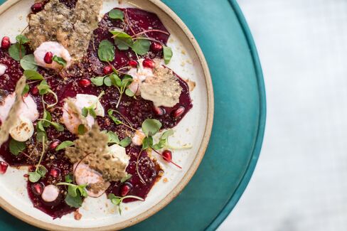 Beetroot carpaccio features goat's cheese, hazelnuts, and date-and-honey syrup.