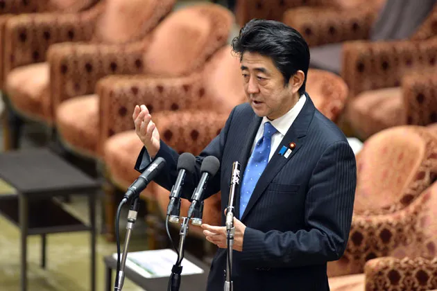 Japanese Prime Minister Shinzo Abe answers questions during a lower house budget committee session at Parliament in Tokyo