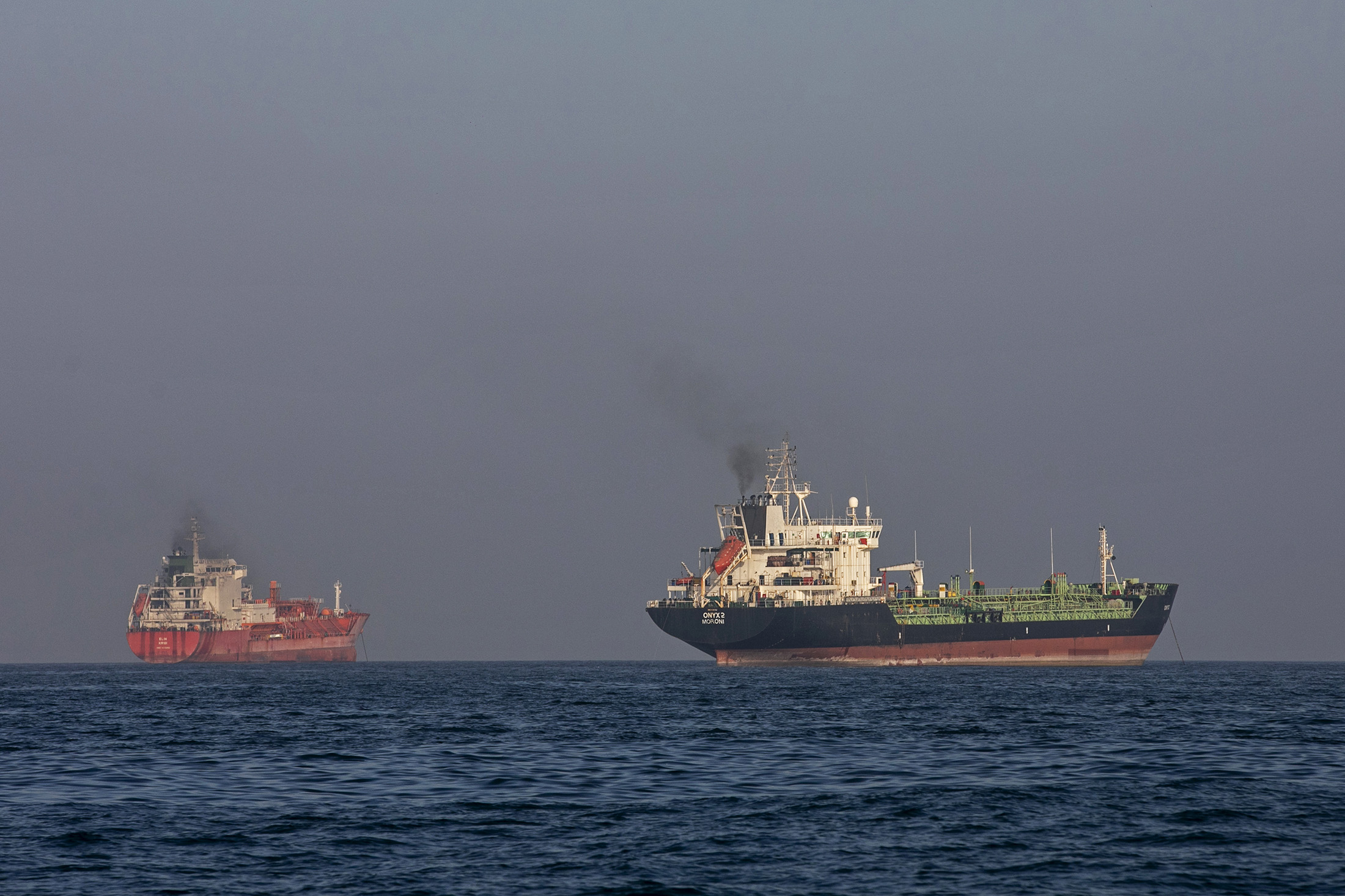 Ships remain anchored in the Strait of Hormuz near Larak Island, Iran, on May 16, 2026. Photographer: Majid Saeedi/Getty Images