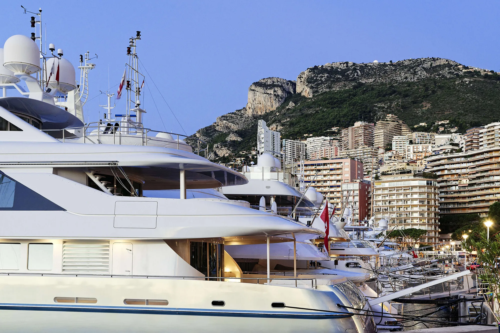 Marina yachts at night in Monaco.