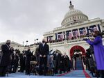 US Vice President-elect Kamala Harris (R) applauds as US President-elect Joe Biden (C) arrives for his inauguration as the 46th US President, on the West Front of the US Capitol in Washington, DC on January 20, 2021.