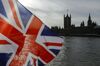 A British Union flag, also known as a Union Jack, flies from a tourist souvenir stall on the bank of the River Thames in view of the Houses of Parliament in London, U.K., on Wednesday, Oct. 30, 2019. U.K. Prime Minister Boris Johnson has succeeded, finally, in getting Parliament to give him the general election that he wants.