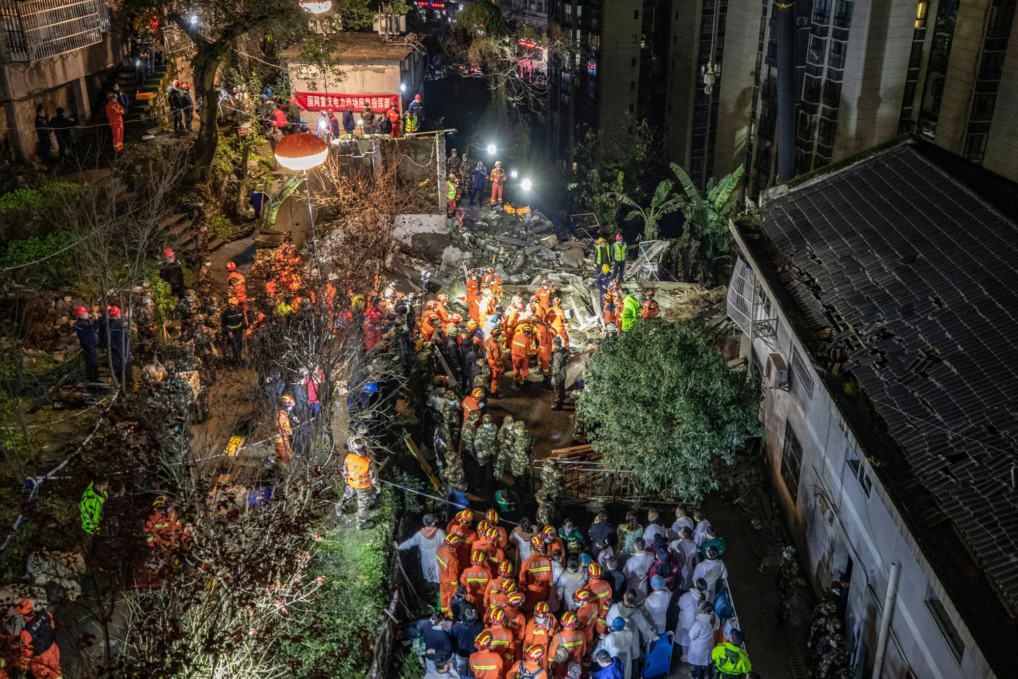 Rescuers search at the scene of an explosion in Chongqing on Jan. 7.