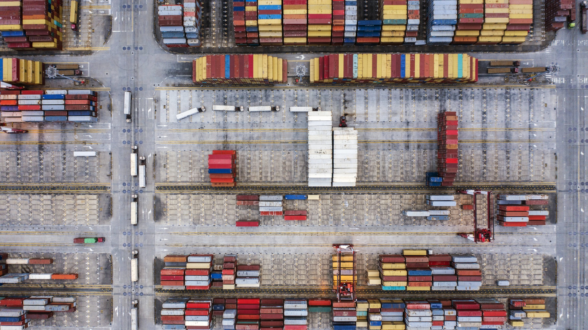Shipping containers sit stacked at the Yangshan Deepwater Port, operated by Shanghai International Port Group Co. (SIPG), in this aerial photograph taken in Shanghai, China, on Friday, May 10, 2019.&nbsp;