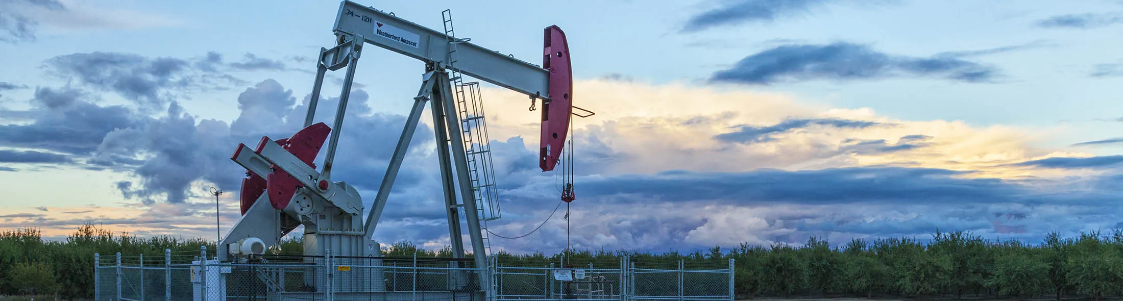 A pump jack and surface water at oil well and fracking site in Shafter. Kern County, located over the Monterey Shale, has seen a dramatic increase in oil drilling and hydraulic fracking in recent years. San Joaquin Valley, California.
