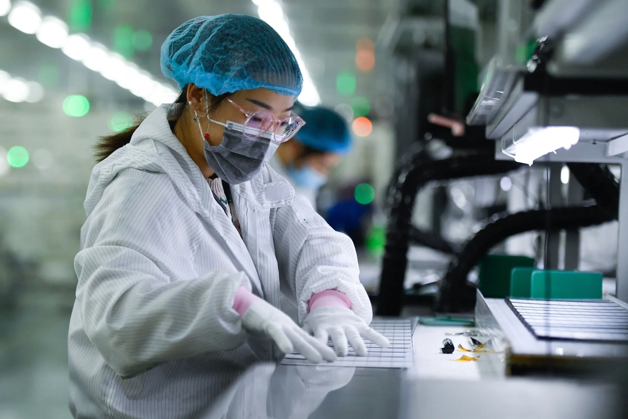 A worker welds solar power components at Jinko Solar&nbsp;Co.&nbsp;in Yiwu City, China.