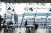 Members sit at the WeWork Cos. Iceberg co-working space in Tokyo, Japan, on Thursday, Dec. 20, 2018. The office-sharing giant, valued at as much as $42 billion, is getting a greater portion of its business from the large companies that property owners usually court. It's also building an investment division to buy its own sites, according to people with knowledge of the matter.