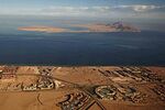 The Red Sea's Tiran island, foreground, and the Sanafir island, background, in the Strait of Tiran between Egypt's Sinai Peninsula and Saudi Arabia.
