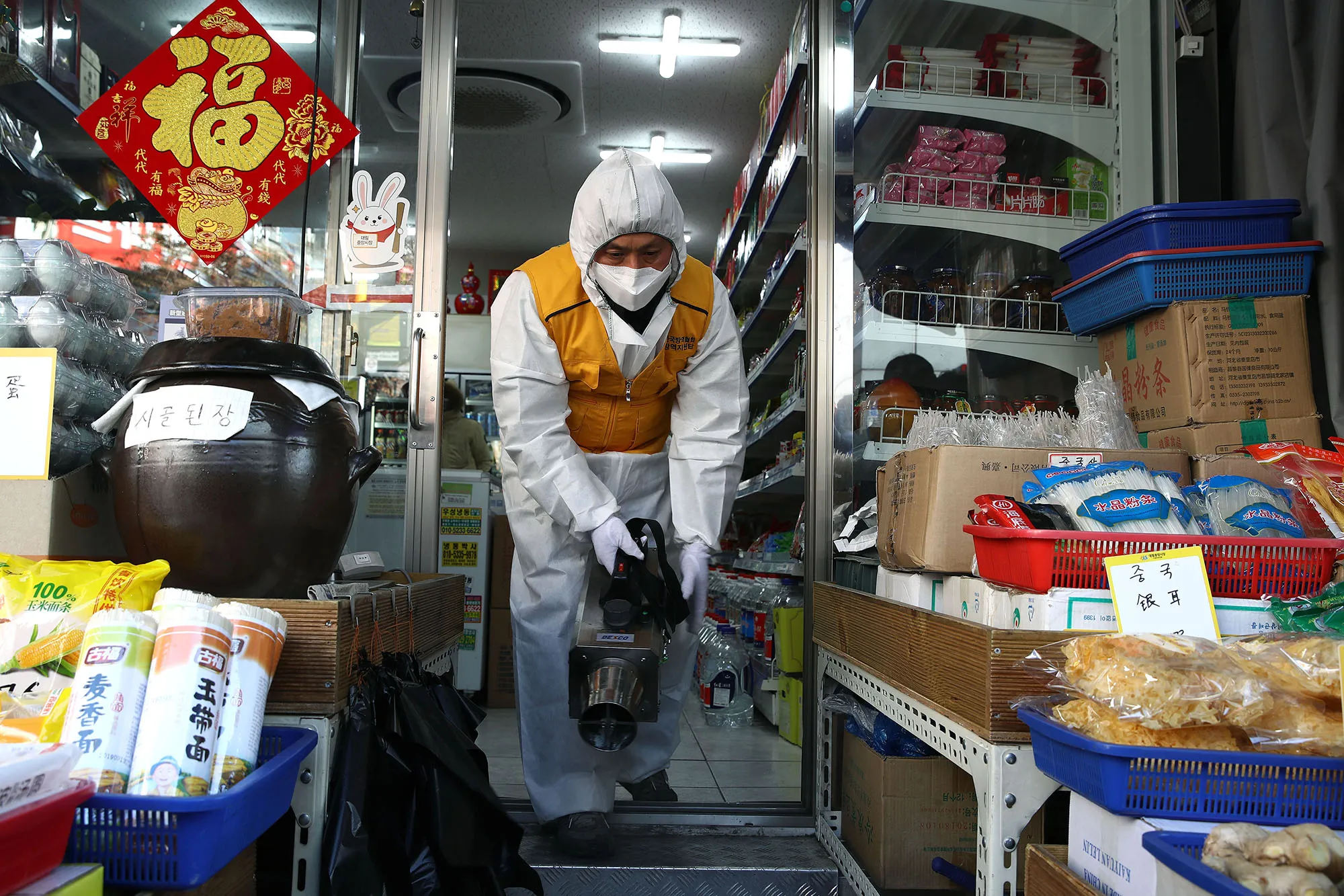 A worker sprays anti-septic solution at a Chinese food store&nbsp;in Seoul&nbsp;on Feb. 5.