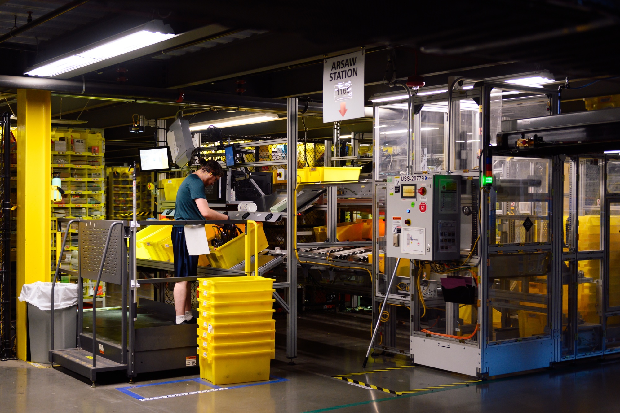 Amazon’s BFI4 fulfillment center in Kent, Washington, where state inspectors strapped ergonomic monitors to workers.