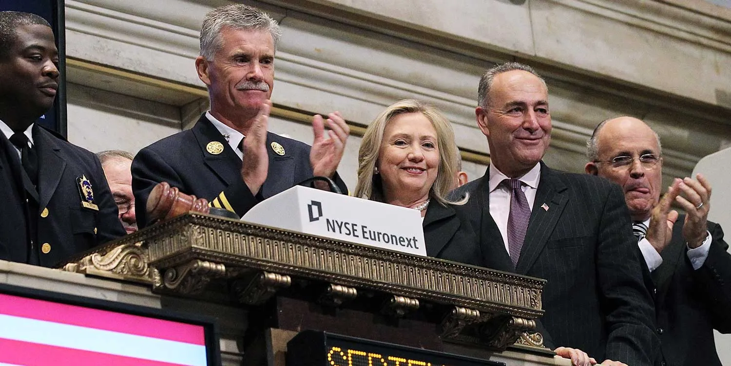 Former New York City Mayor Rudy Giuliani, U.S. Sen. Charles Schumer (D-NY) and U.S. Secretary of State Hillary Clinton look on during the ringing of the opening bell at the New York Stock Exchange on September 9, 2011 in New York City. U.S. Secretary of State Hillary Clinton along with other New York leaders rang the opening bell at the NYSE ahead of the tenth anniversary of the September 11 terror attacks
