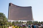 Guests wait in line outside of the Wynn Resorts Ltd. Encore Boston Harbor casino during an opening day event in Everett, Massachusetts, on June 23.