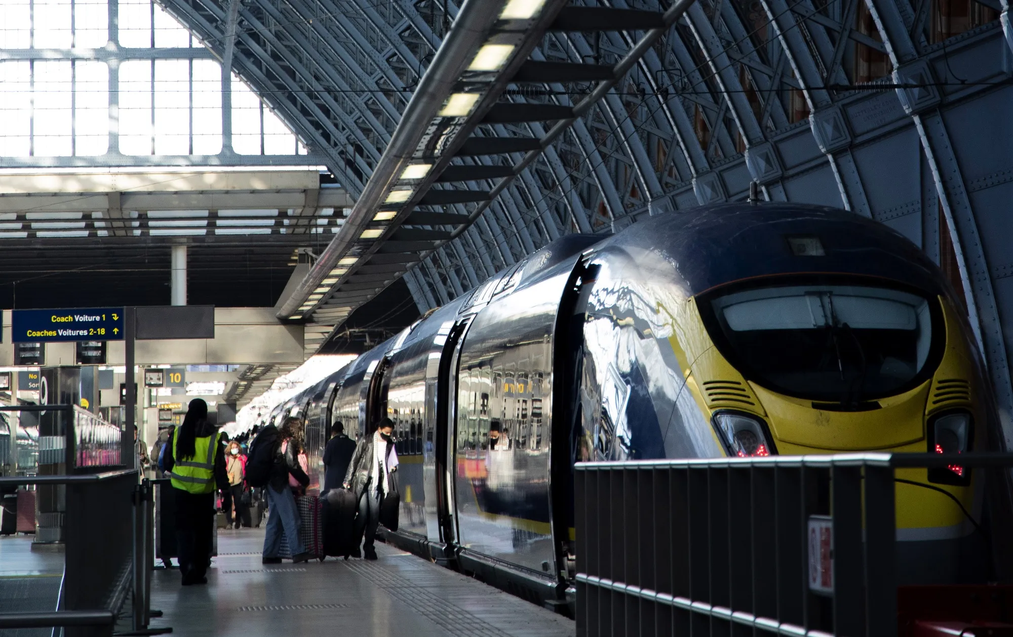 Passengers board a Eurostar International Ltd. train service to Paris, at St Pancras International Station in London.