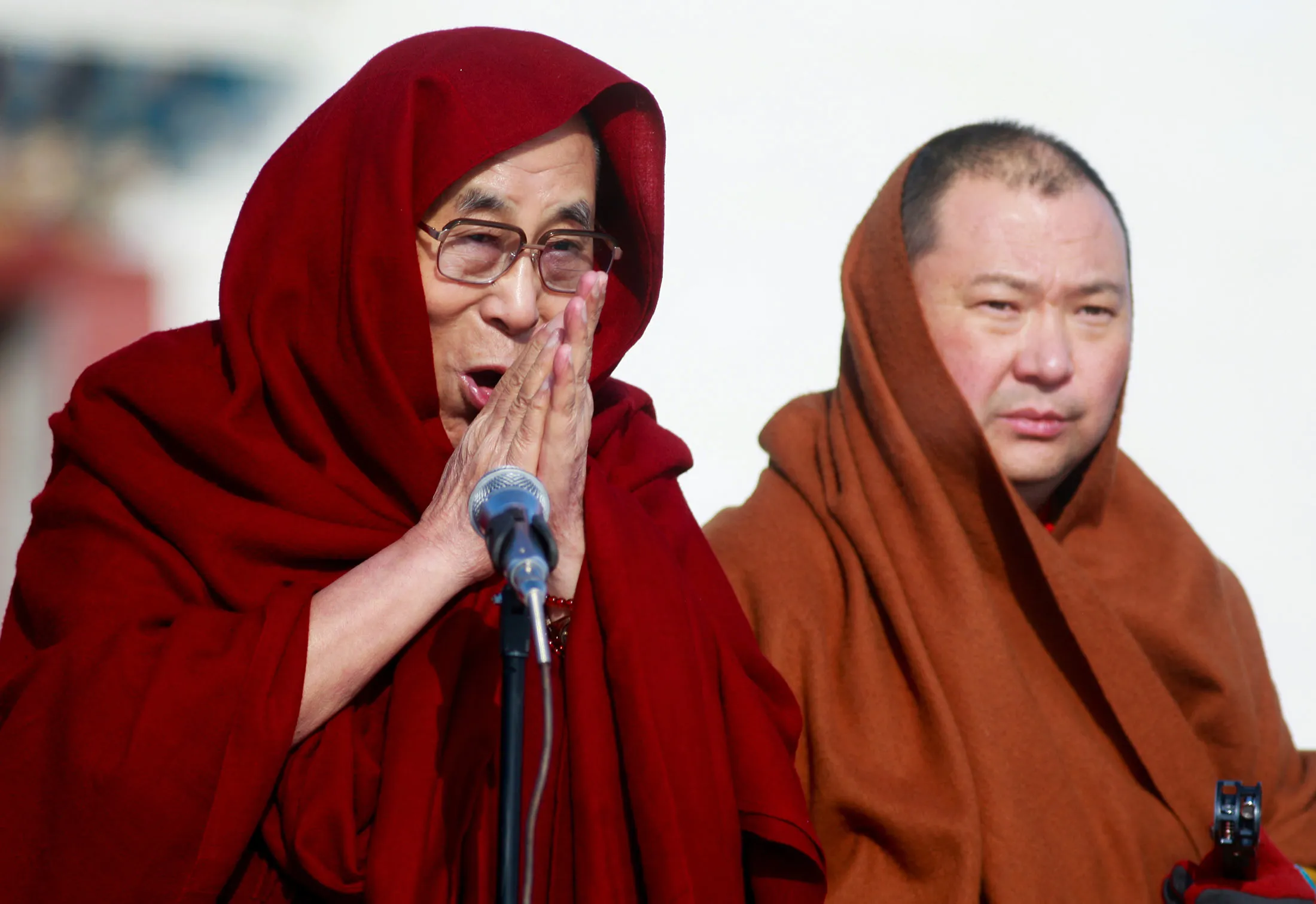 The Dalai Lama , left, speaks to worshippers in -20 degrees Celcius temperatures at the Gandantegchilen monastery in Ulan Bator, the capital of Mongolia, on Nov. 19, 2016.
