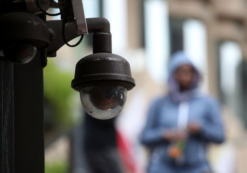 A video surveillance camera hangs from the side of a building on May 14, 2019 in San Francisco. That year, the city became the first to pass a surveillance regulation law, but now Mayor London Breed wants to roll back some of its provisions in a ballot initiative. 