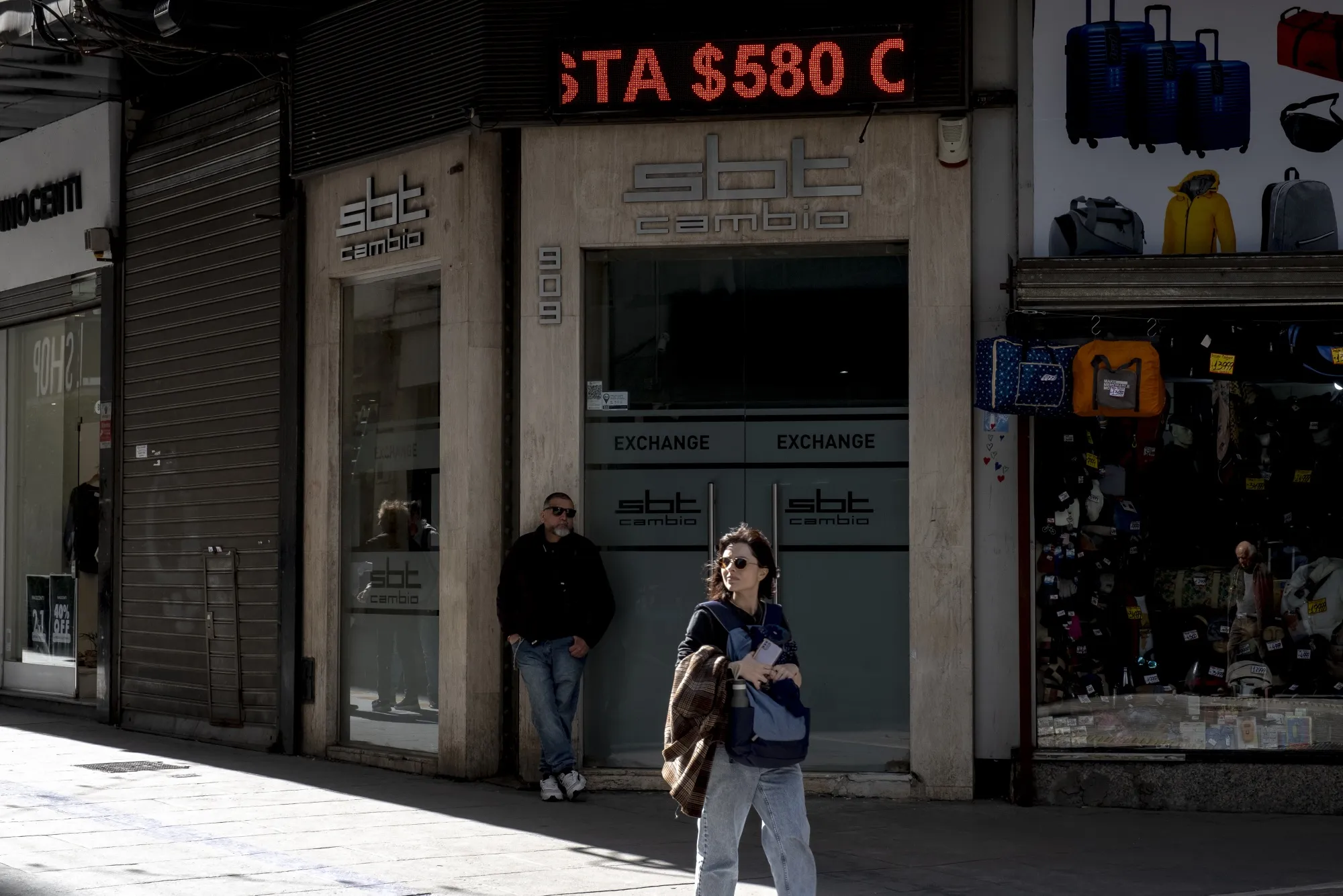 To cope with the pressure of the market fallout, the government — which has drained reserves to defend the currency — devalued the official foreign exchange rate by 18%.