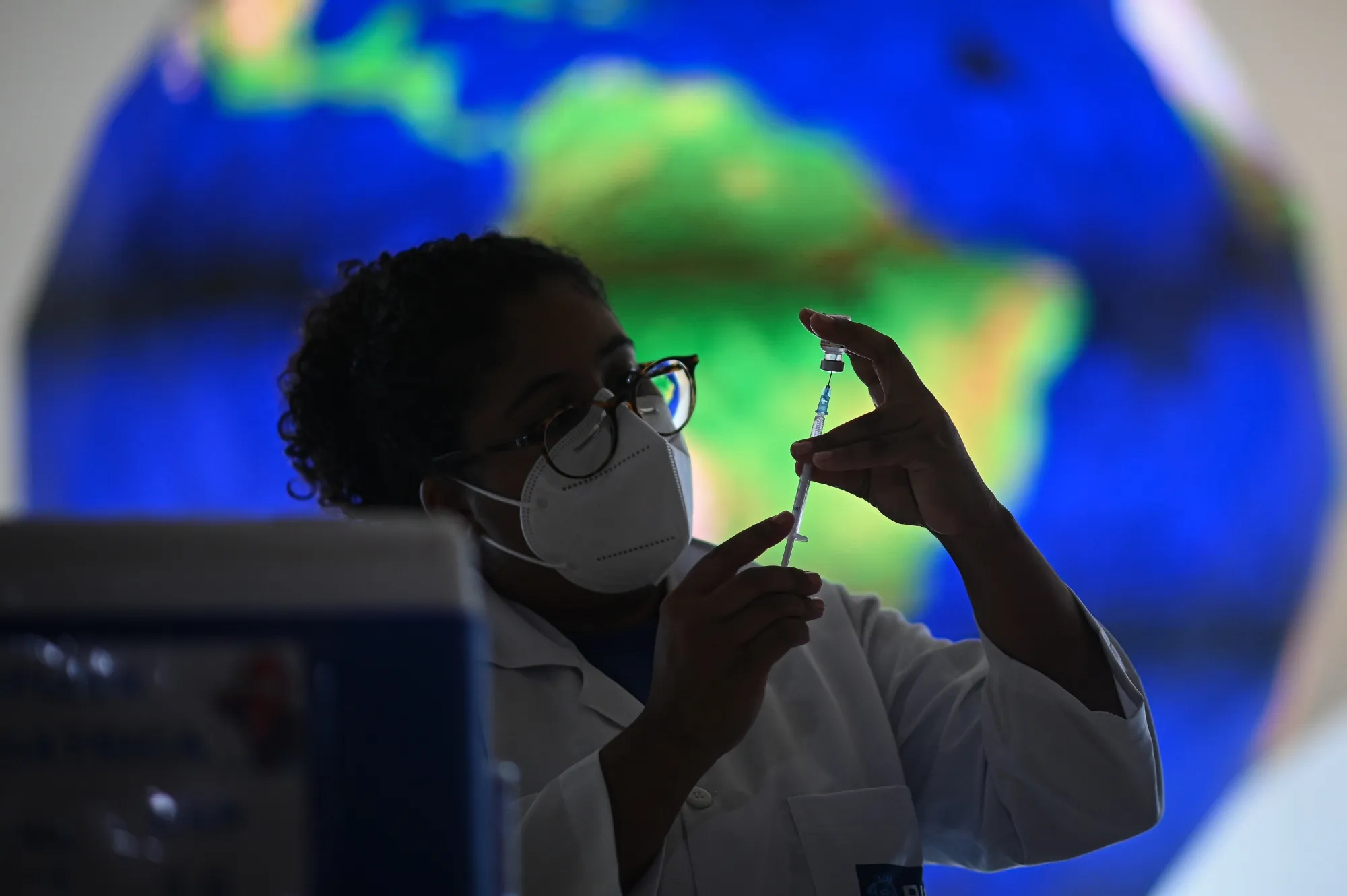 A health care worker prepares a dose of the Pfizer-BioNTech Covid-19 vaccine&nbsp;in Rio de Janeiro.
