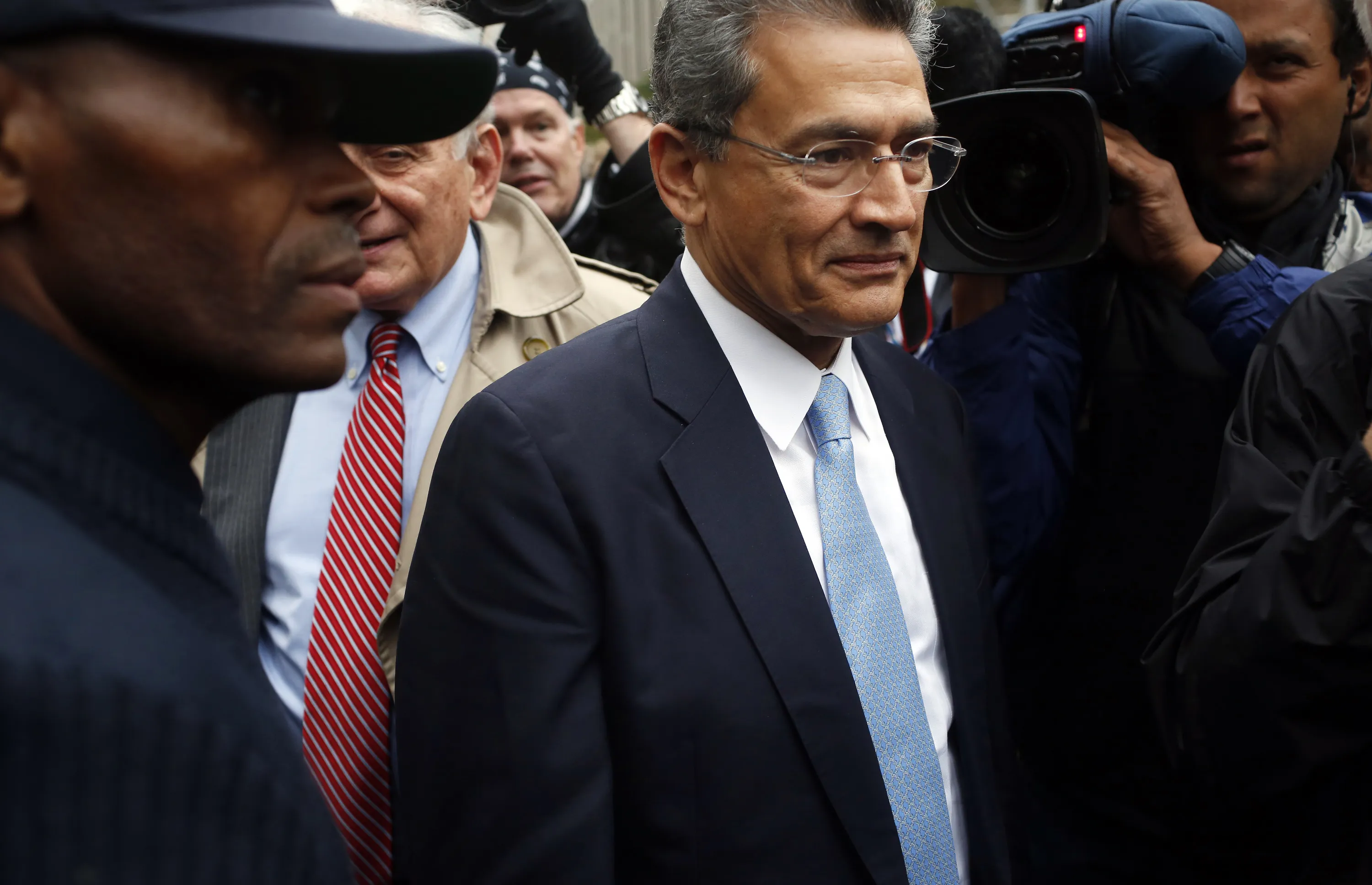 Rajat Gupt exits federal court after being sentenced for insider trading in New York in 2012.