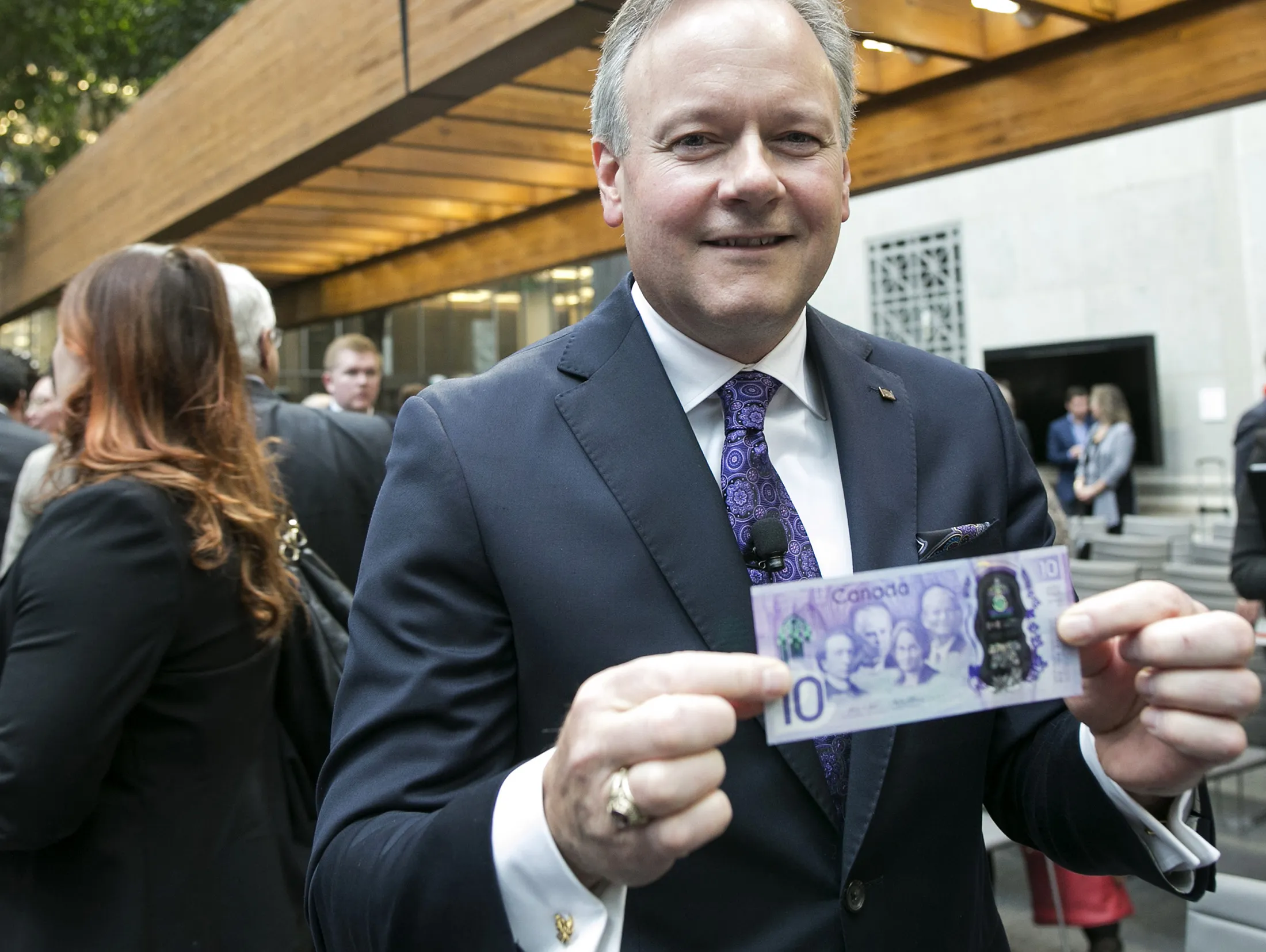 Stephen Poloz holds a copy of a commemorative $10 note at Bank of Canada headquarters in Ottawa, Ontario, Canada, on April 7, 2017.
