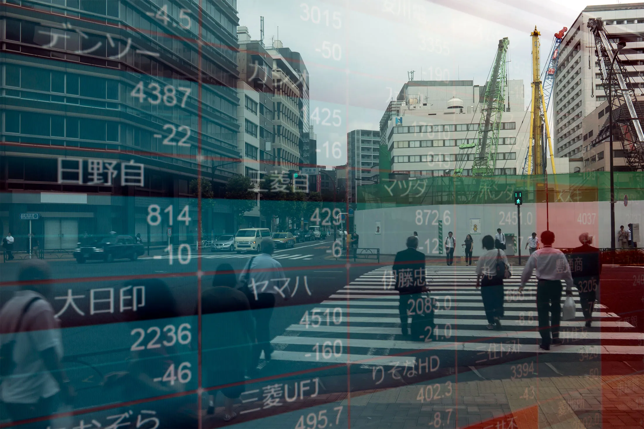 Pedestrians are reflected in an electronic stock board outside a security firm&nbsp;in Tokyo.