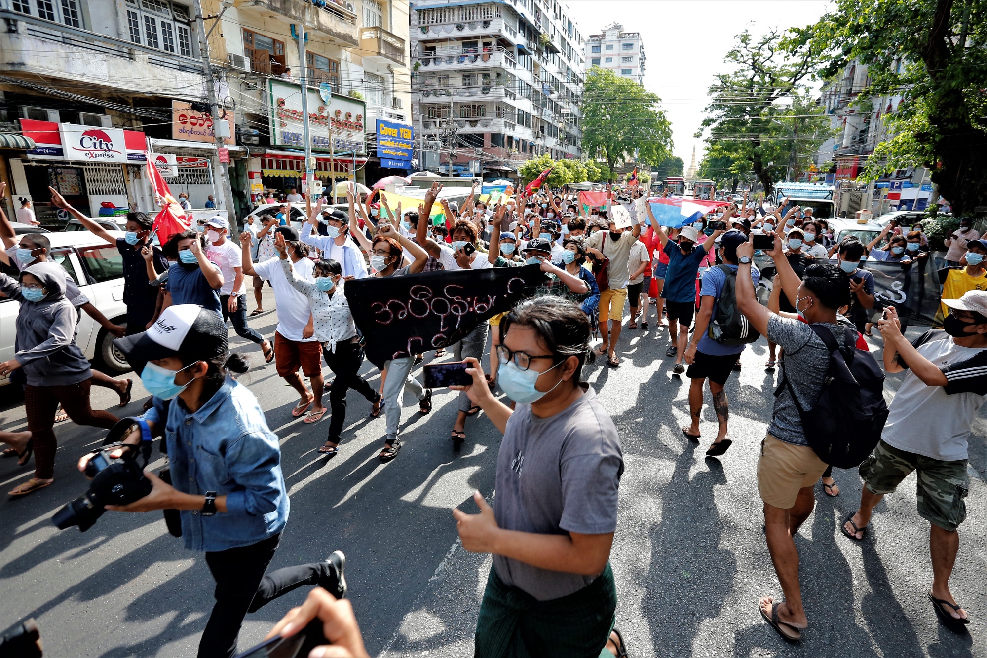Myanmar journalists document a flash mob protest against the military coup in Yangon on May 6.