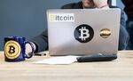 An employee uses a laptop computer branded with bitcoin logos inside the offices of La Maison du Bitcoin bank in Paris, France.