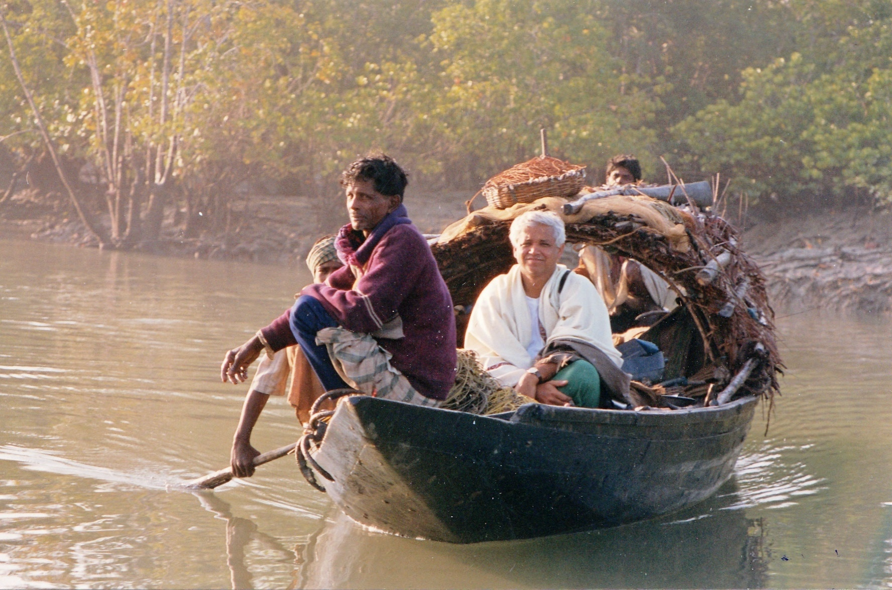 Ghosh (center) visiting the Sundarbans on a crab-fishing boat in 2000. He was researching his novel The Hungry Tide.