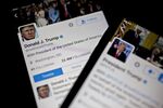 The Twitter Inc. accounts of U.S. President Donald Trump, @POTUS and @realDoanldTrump, are seen on an Apple Inc. iPhone arranged for a photograph in Washington, D.C., U.S., on Friday, Jan. 27, 2017.