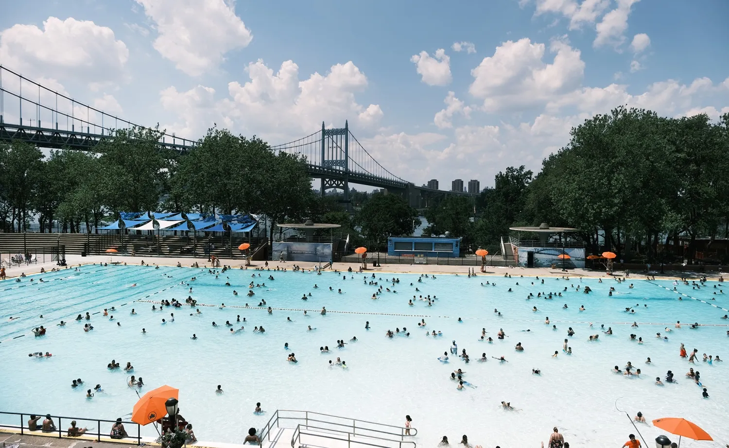 People cool off in a public swimming pool in the Astoria neighborhood of Queens, New York.