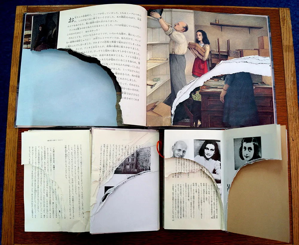 Ripped pages of three books of Anne Frank's "Diary of Young Girl" are displayed at a library in Tokyo on February 21, 2014. Photograph: JIJI Press/AFP/Getty Images