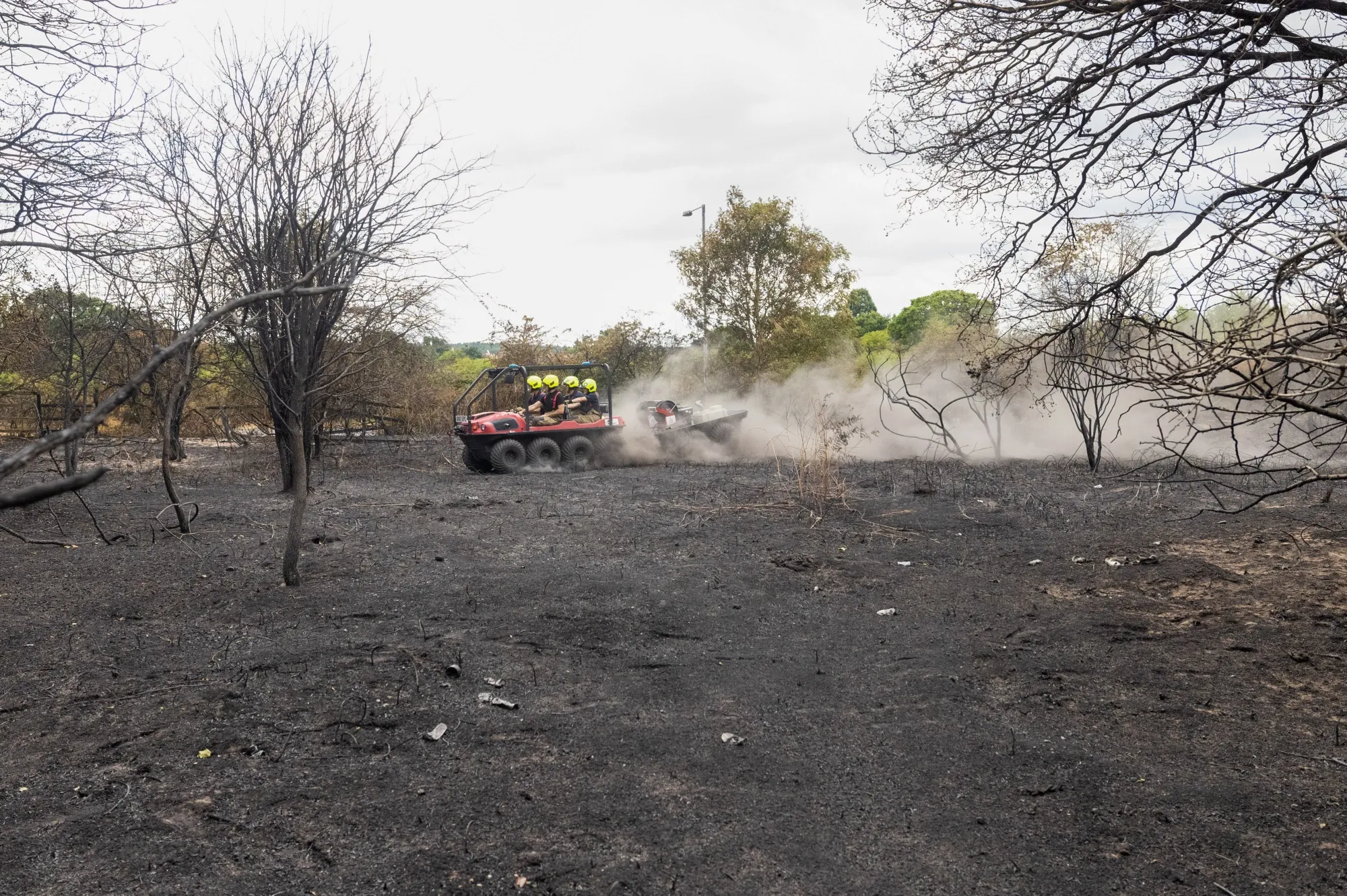 Firefighters on a buggy pass through Dartford Heath, following a major fire during a heat wave, near Dartford, UK, on July 20.