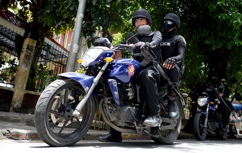 SWAT personnel patrol the streets of Manila on Sept. 3.