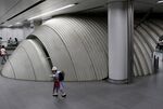 A schoolgirl walks through a Tokyo subway station.