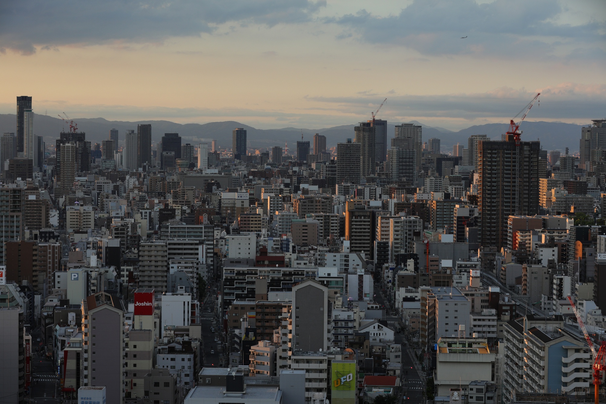 Commercial and residential buildings are on the horizon at dusk in Osaka, Japan, Thursday, May 21, 2020. Japanese Prime Minister Shinzo Abe told reporters that if current trends of new infections continue, he believes it is possible to lift the state of emergency.  in Tokyo, as well as the surrounding prefectures and Hokkaido as early as May 25.  Abe was speaking when the emergency was lifted in Osaka and two neighboring prefectures.