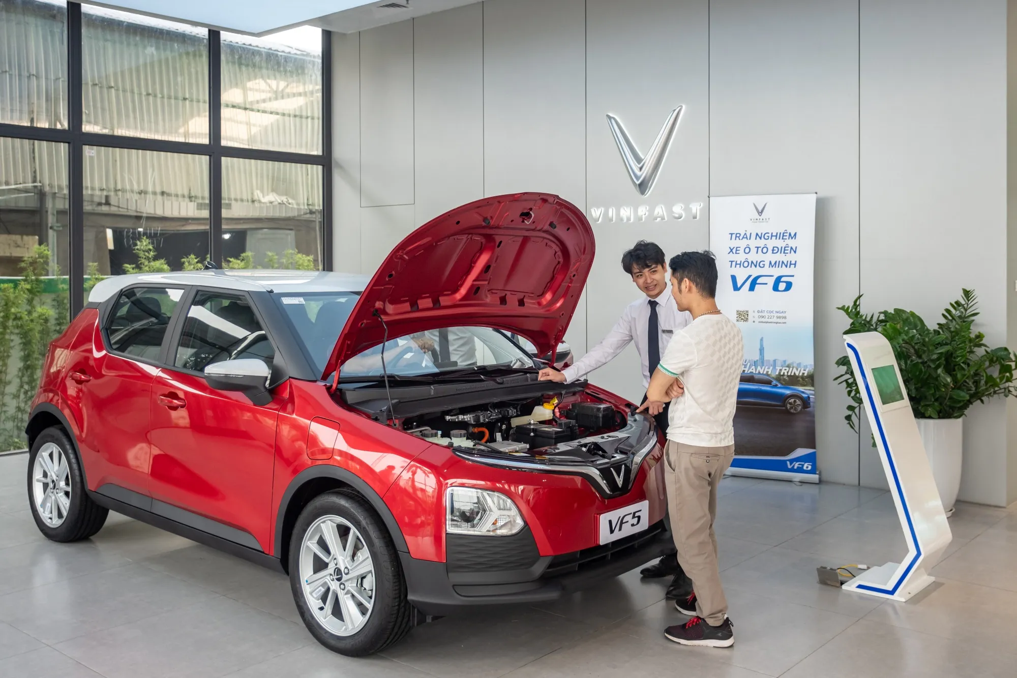 An employee assists a customer at a VinFast showroom in Hanoi.