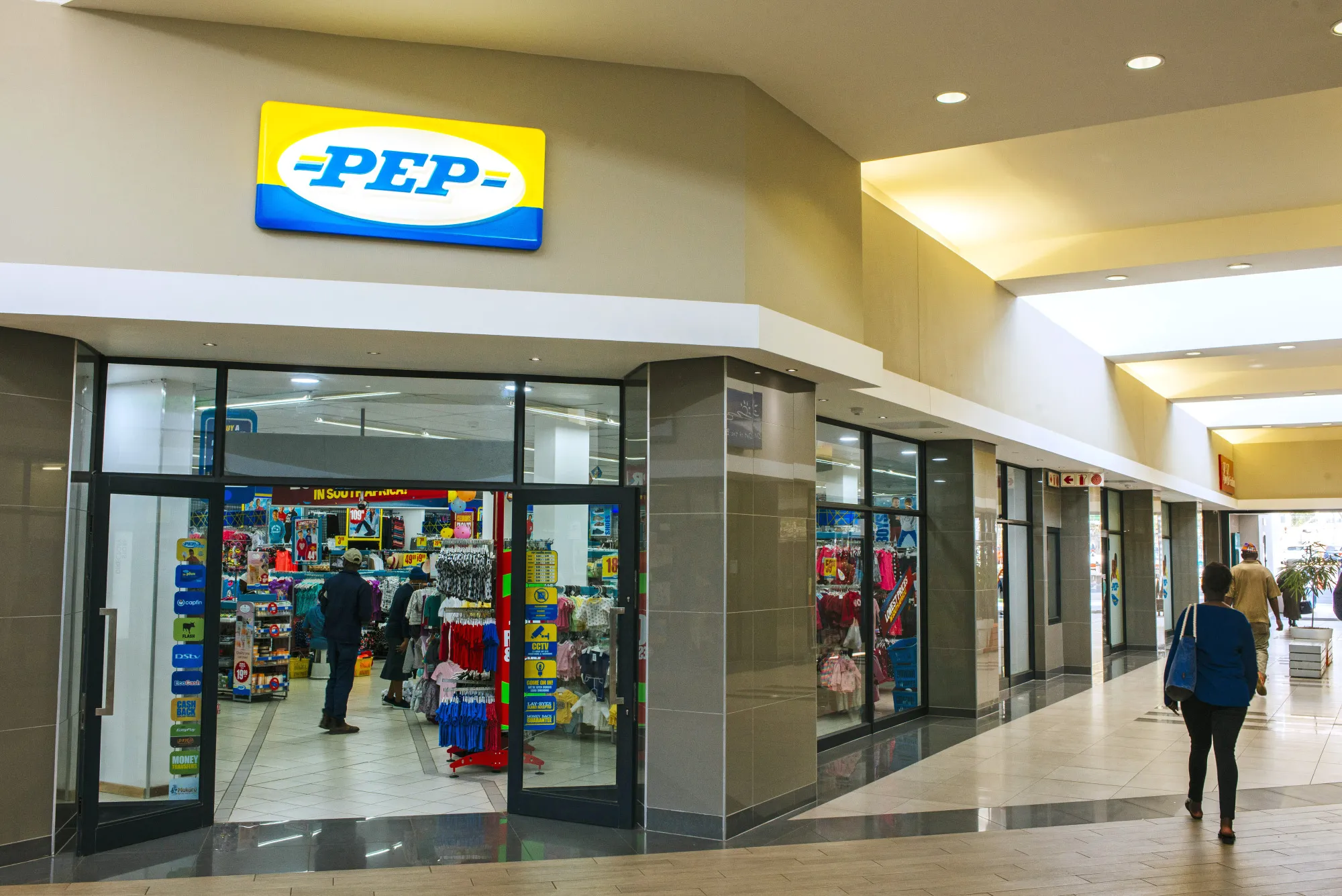 Customers browse goods inside a PEP retail store, operated by Pepkor Ltd., in Johannesburg, South Africa.