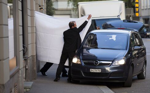 FIFA officials are escorted out following their arrests at the Baur au Lac hotel, on May 27, 2015.