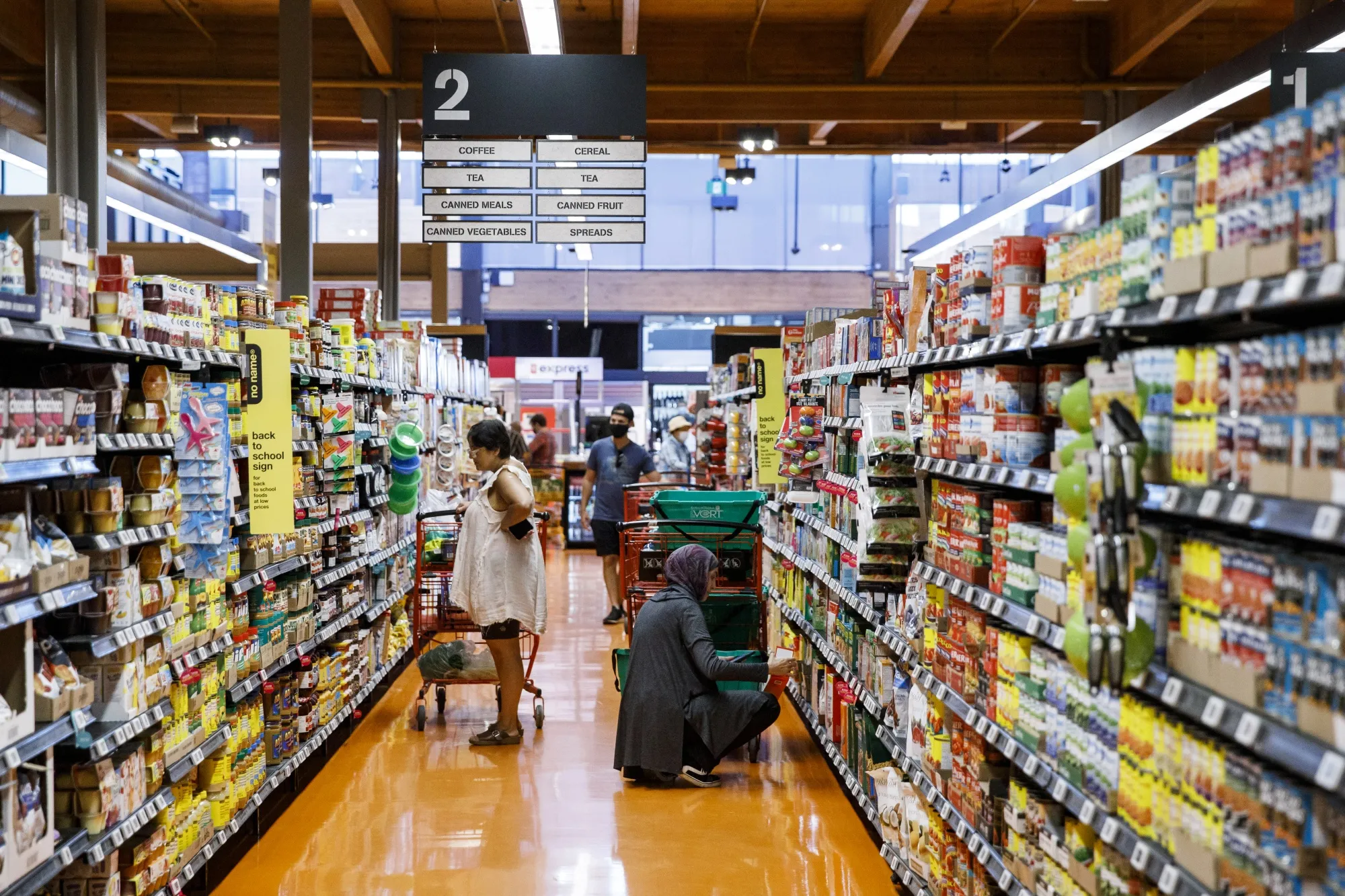 Shoppers at a grocery store in Toronto.