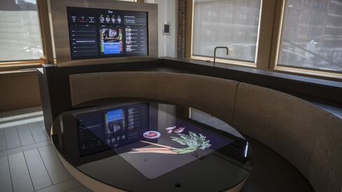 A touchscreen table, optimized with Innit technology that integrates other appliances to manage your kitchen.