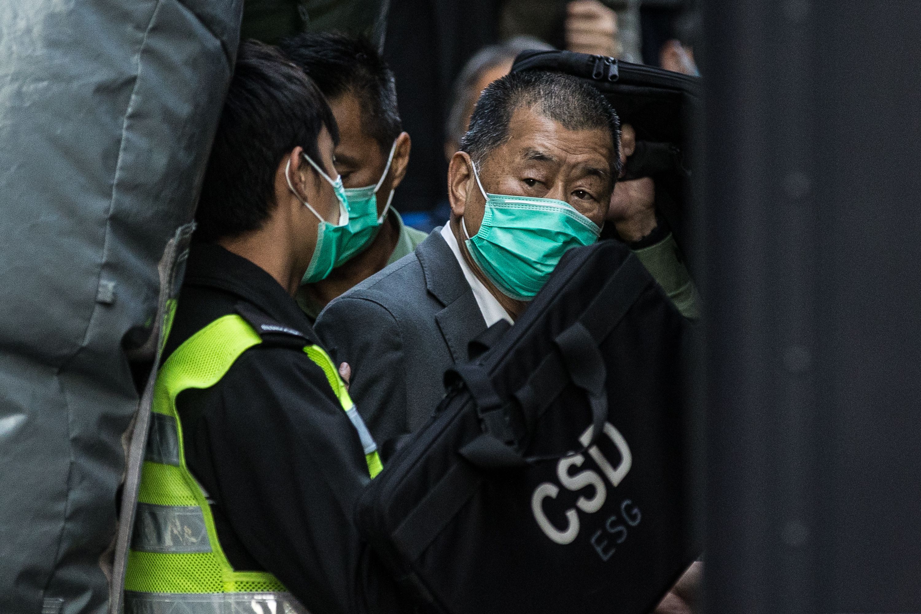 Jimmy Lai is escorted into a Hong Kong Correctional Services van outside the Court of Final Appeal in Hong Kong in 2021. Photographer: AFP/Getty Images