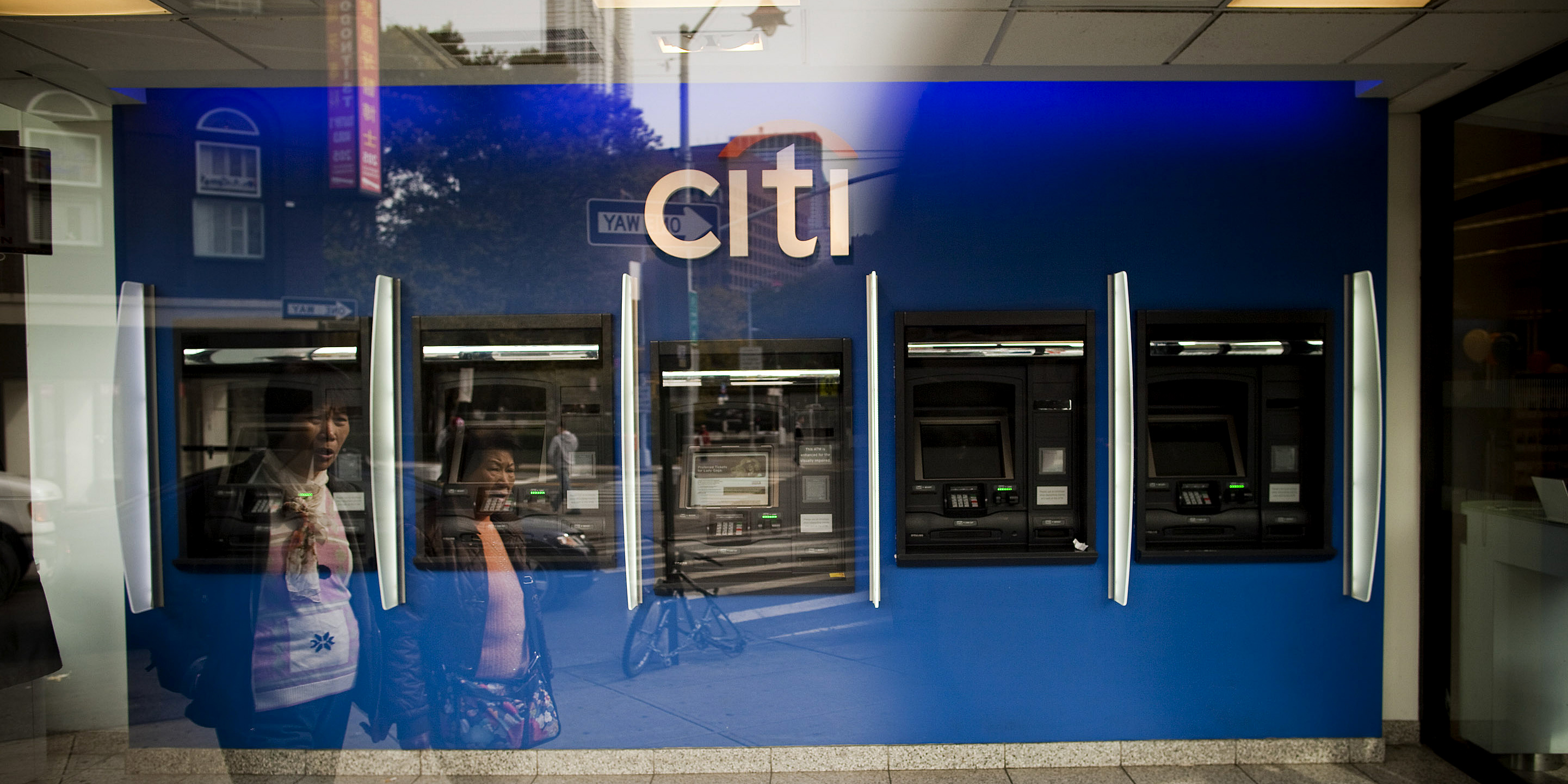 Pedestrians walk past a Citigroup Inc. Citibank branch in New York.