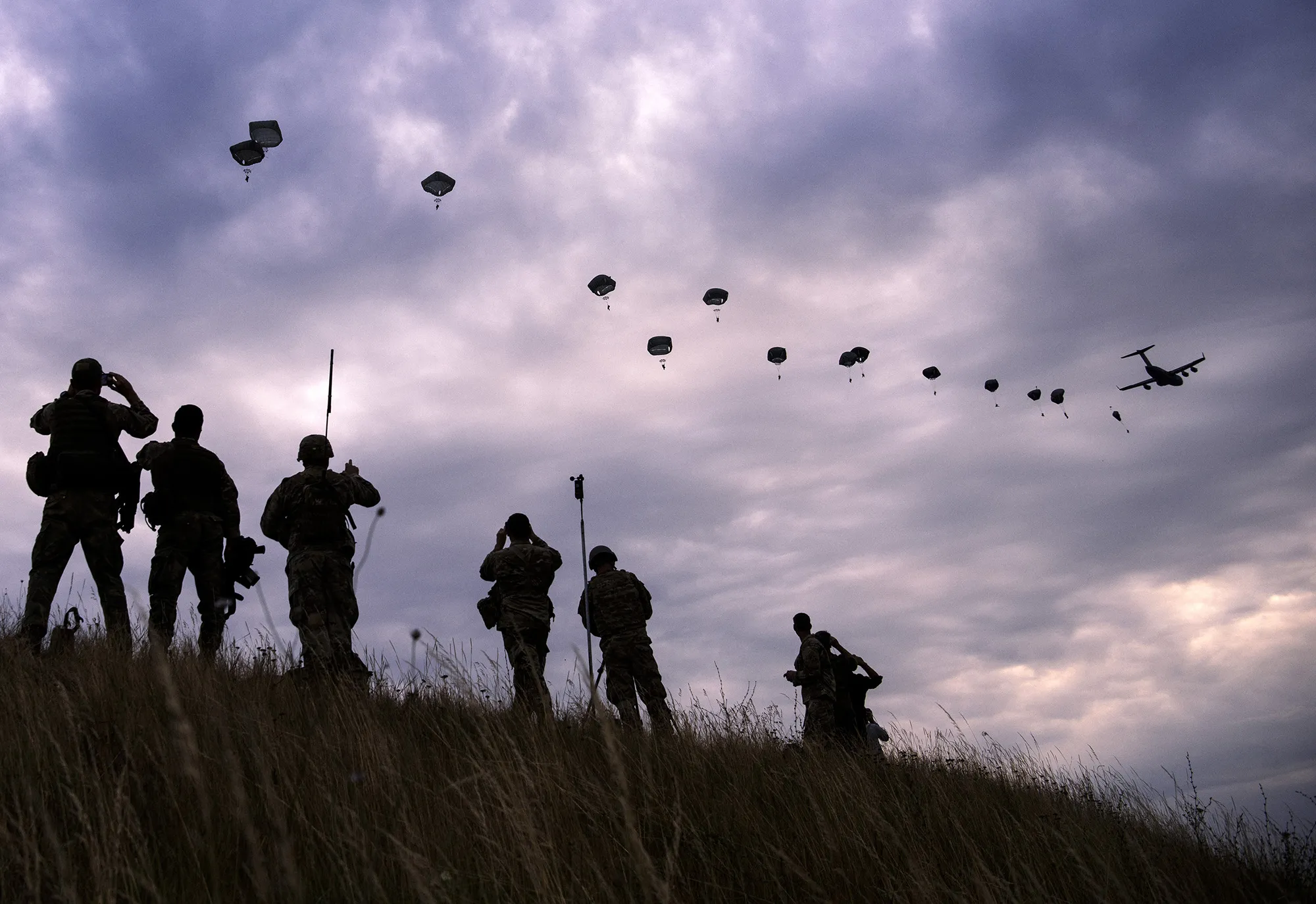 NATO paratroopers drop out of a U.S. Air Force Hercules during a joint military exercise at Bezmer airfield near the village of Bezmer, Bulgaria&nbsp;in 2017.&nbsp;
