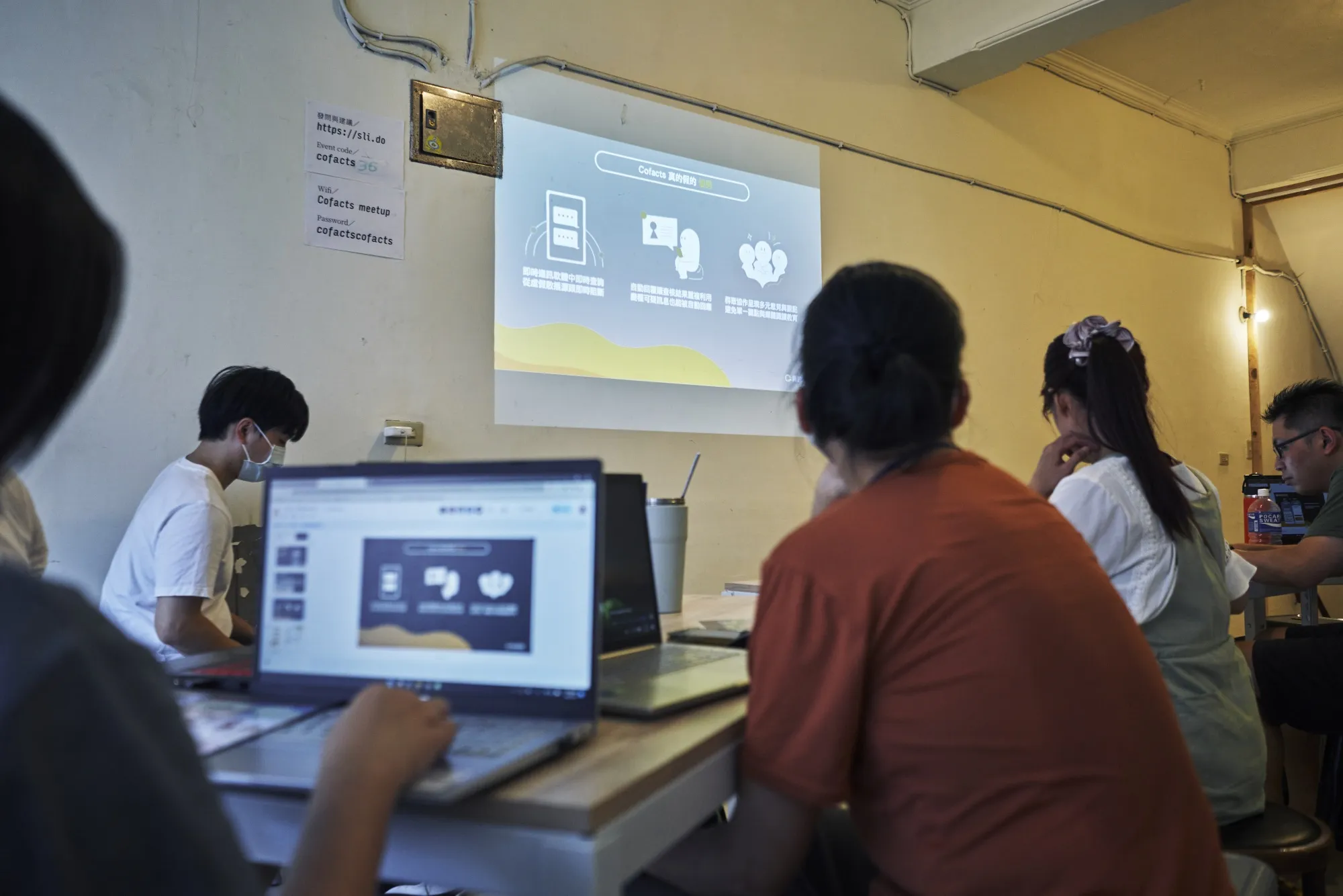 Participants in a CoFacts workshop, discussing how to fact check sources and news in Keelung, Taiwan on July 9th.