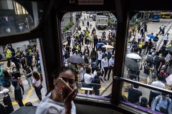 Working in Hong Kong: Hellish Commutes, Tear Gas, Tumbling Sales