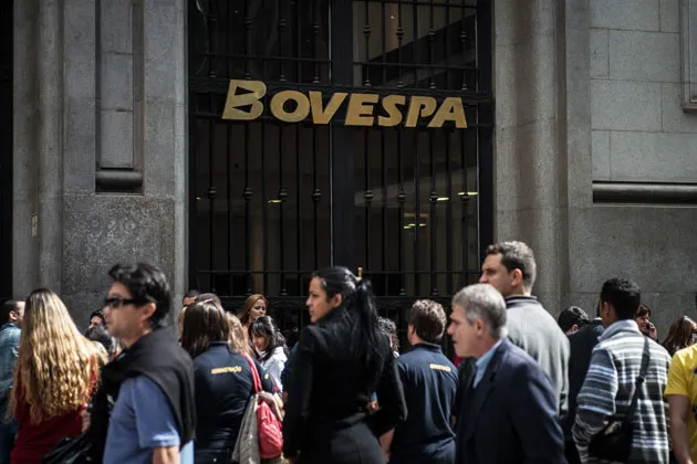 People walk past the Bovespa stock exchange in São Paulo