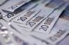 Twenty euro banknotes are arranged for a photograph inside a Travelex store, operated by Travelex Holdings Ltd., in London, U.K., on Monday, Jan. 12, 2015. The euro approached a nine-year low against the dollar as European Central Bank officials fueled speculation the institution will start a program of government-bond buying as early as next week to stave off deflation.