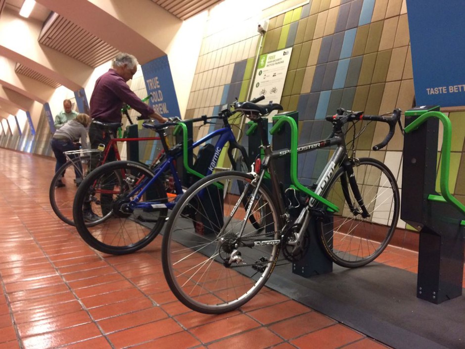 People use the new Internet-connected bike racks at a BART station in San Francisco.